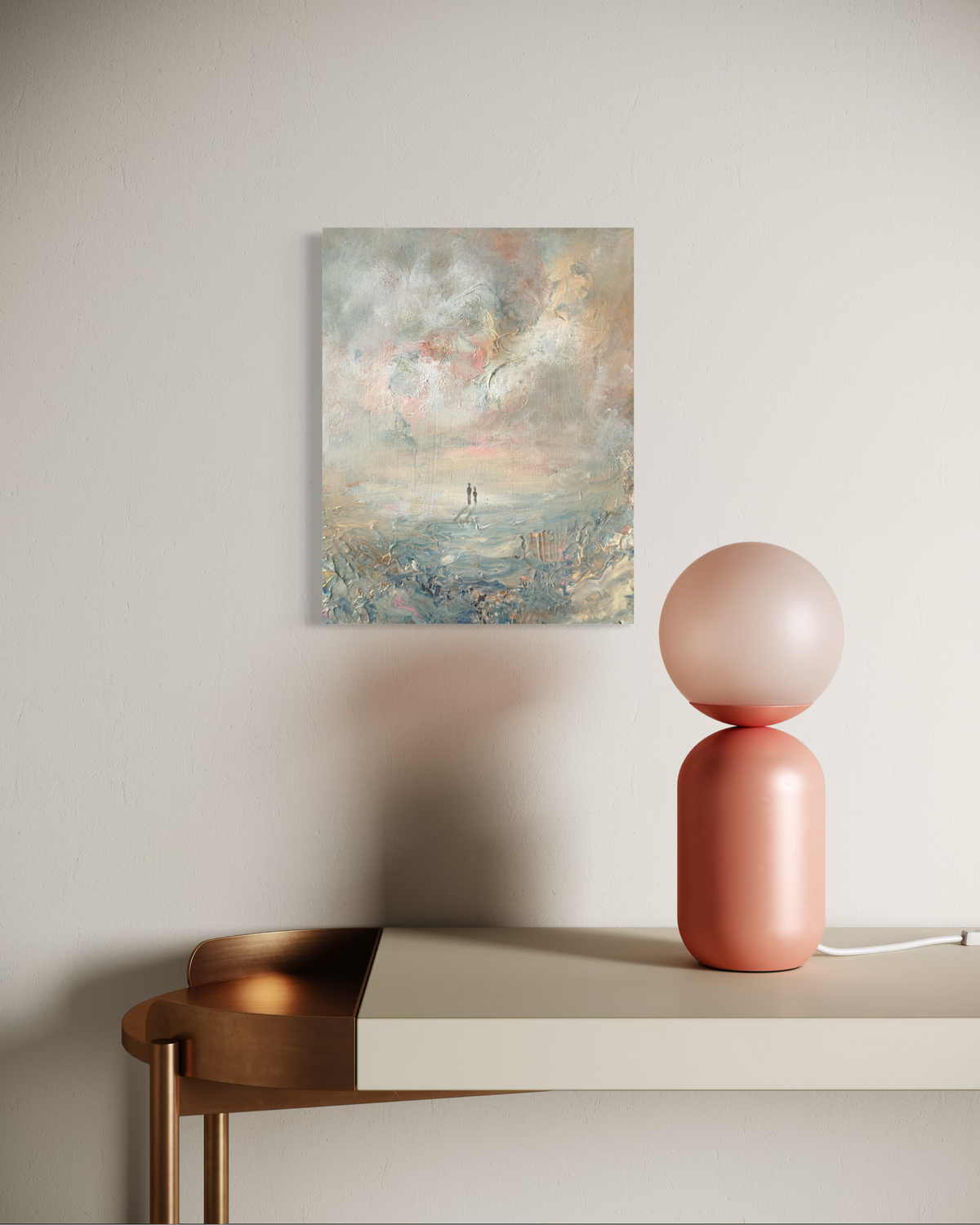 Pink table lamp on a white surface with a painting on the wall in the background.